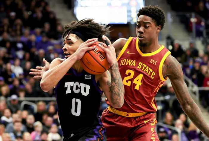TCU Horned Frogs guard Micah Peavy (0) drives to the basket as Iowa State Cyclones forward Hason Ward (24) defends during the first half at Ed and Rae Schollmaier Arena.